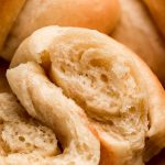 Close up shot of the inside of a light and fluffy crescent roll.