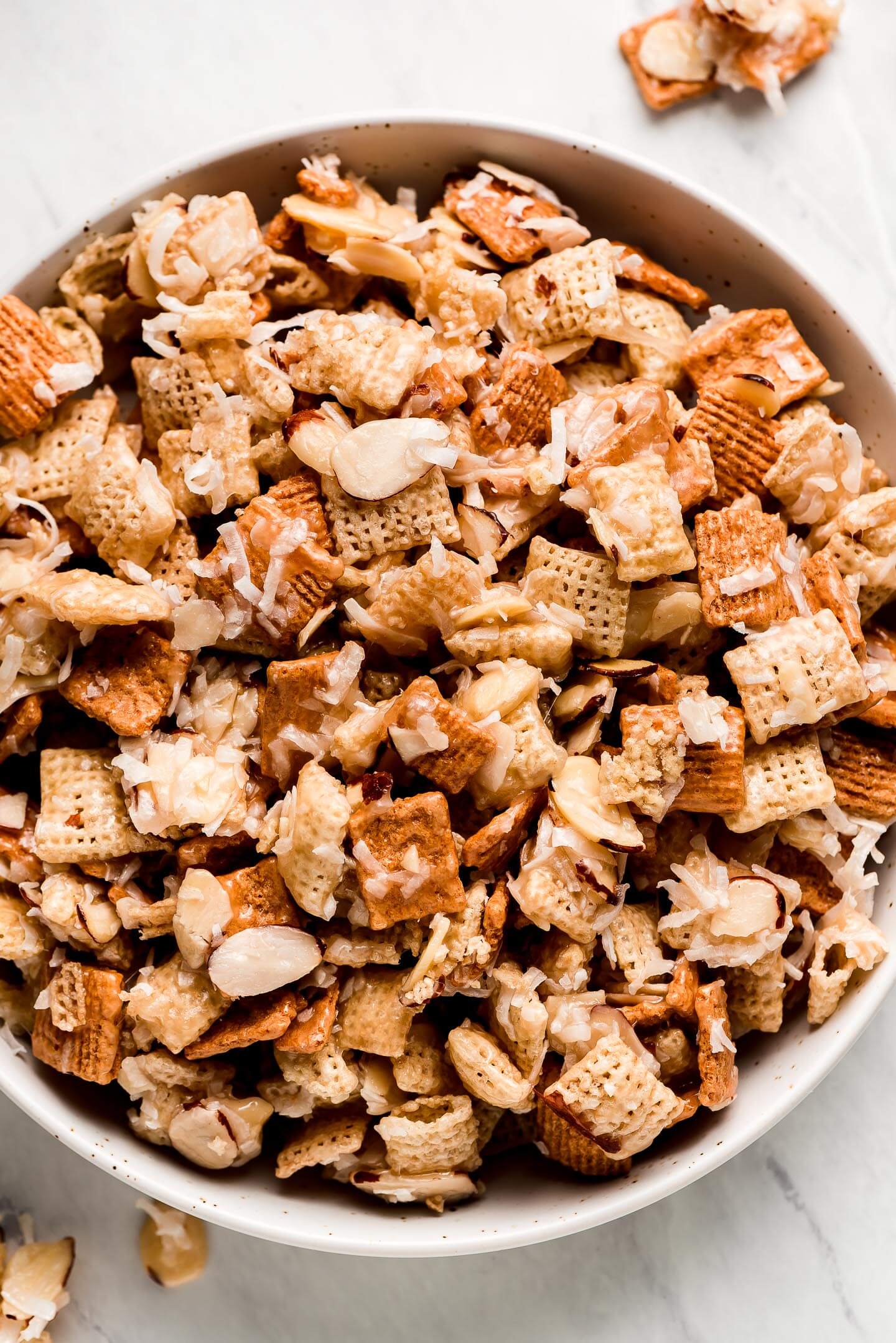 Close up of Gooey Holiday Chex Mix in a bowl.