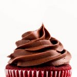 One Red Velvet Cupcake topped with chocolate frosting.