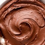 A bowl of swirled Chocolate Cream Cheese frosting.