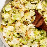 A skillet of sautéed cabbage and onions.