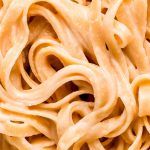 Close up shot of fettuccini alfredo noodles.