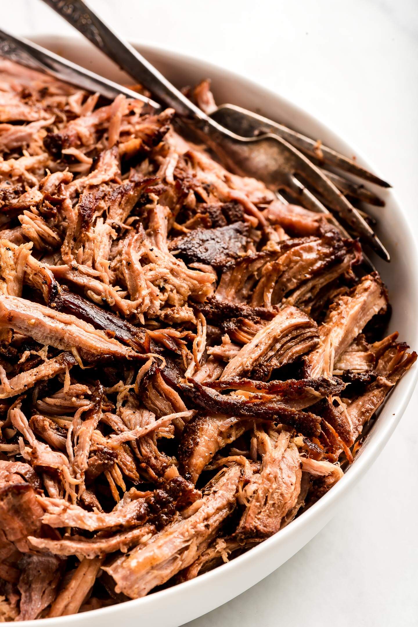 Close up of pulled pork in a bowl.