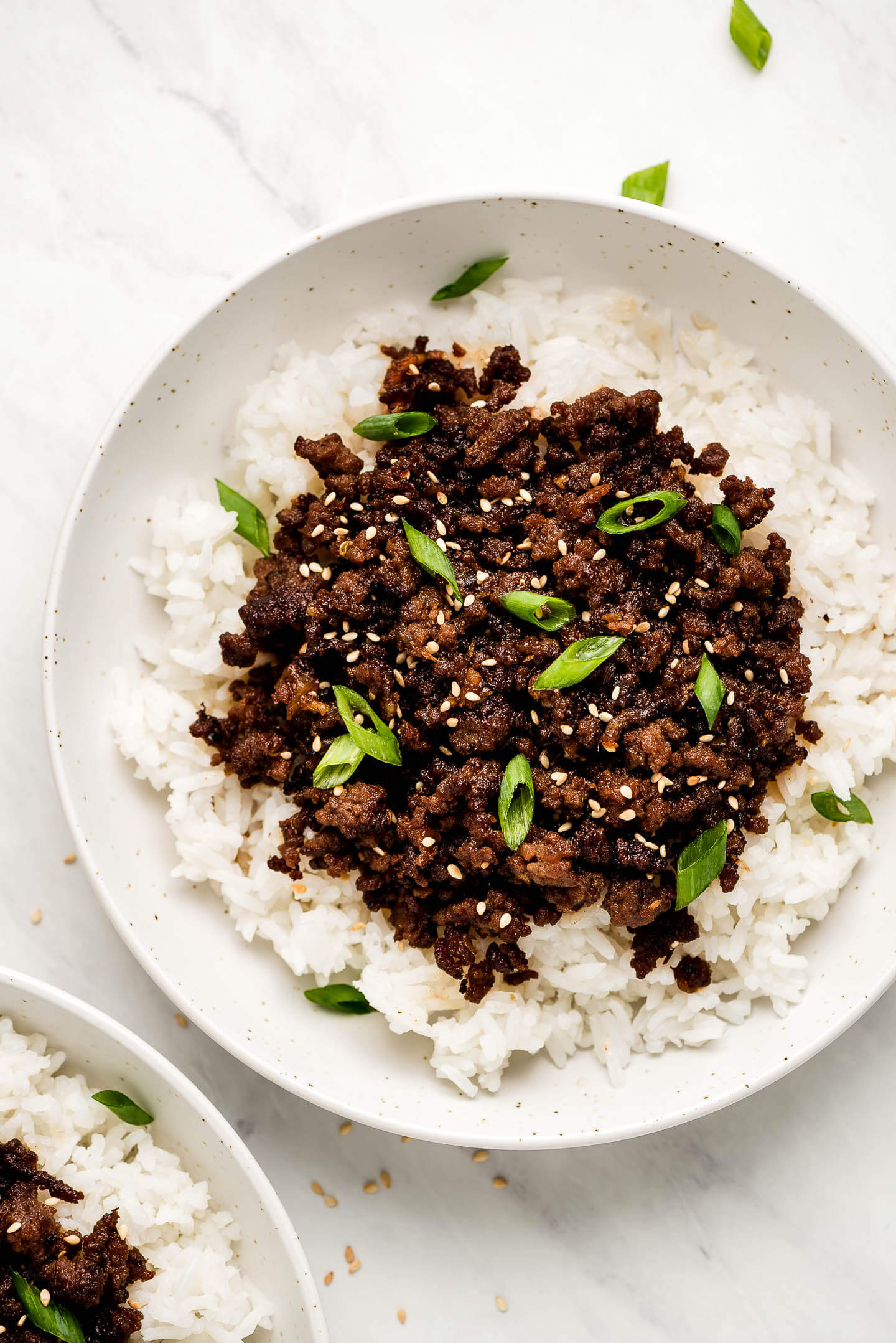 Two bowls of rice topped with Korean Ground Beef.