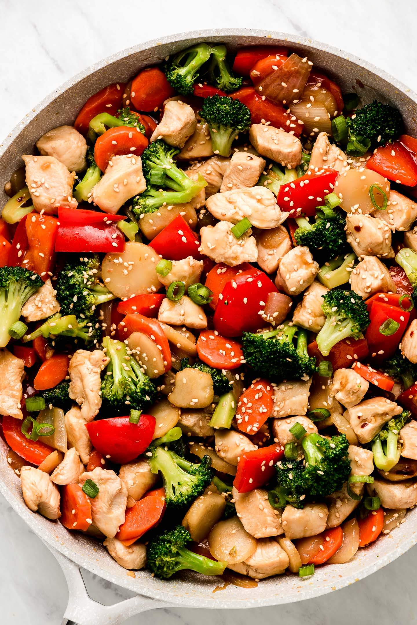Chicken Stir Fry with vegetables in a skillet.
