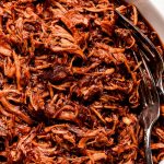 Shredded BBQ Chicken in a white serving bowl.