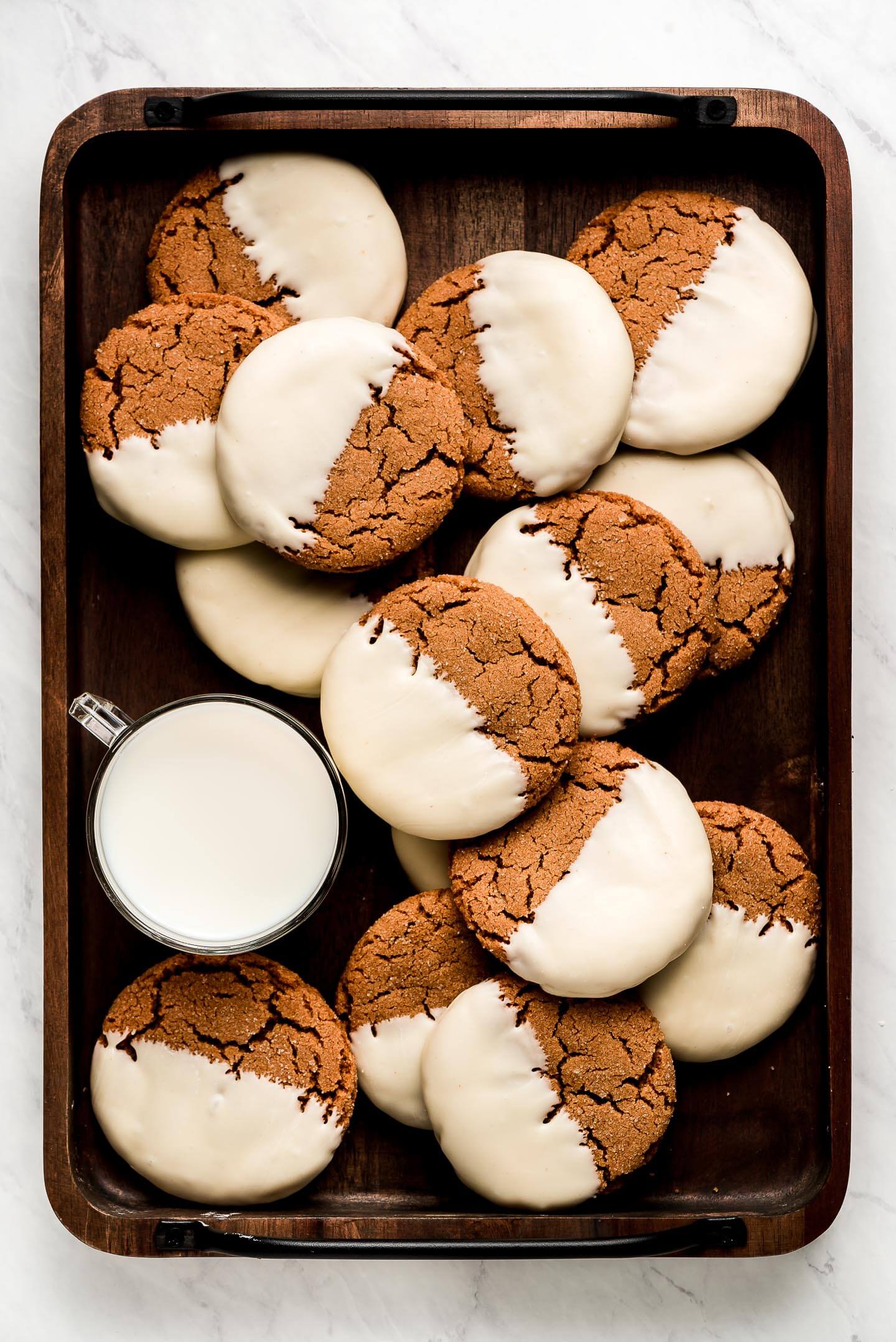 A tray of milk and White Chocolate Dipped Gingersnaps.