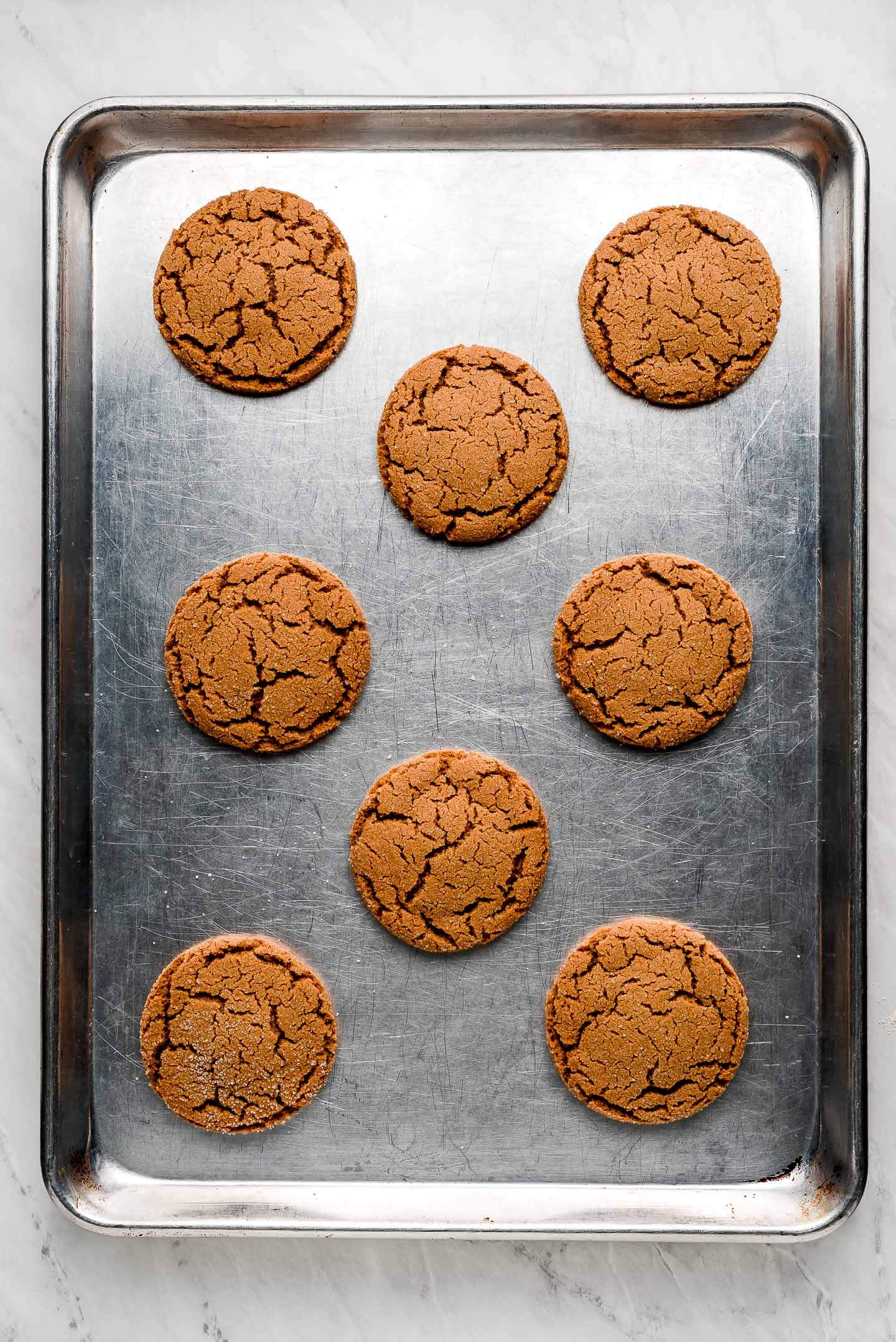 Gingersnap cookies on a baking sheet.